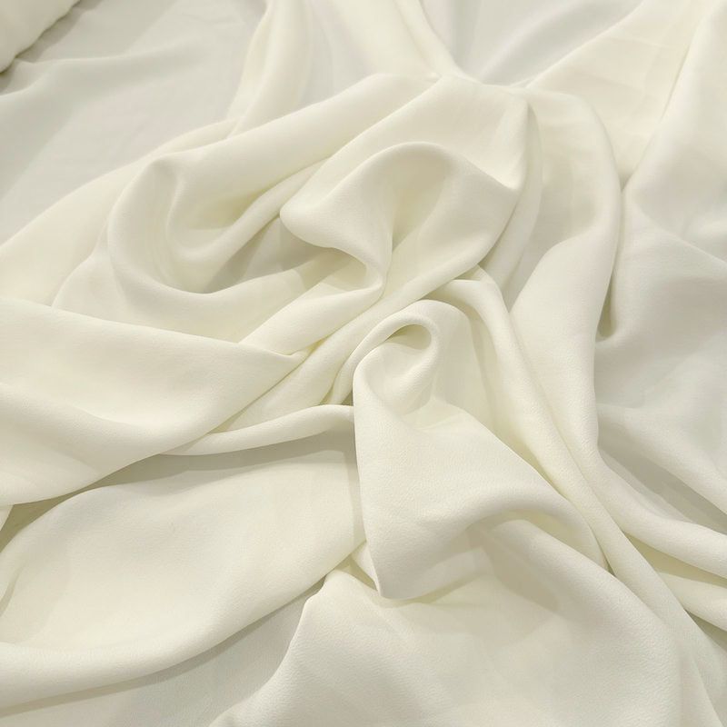 Tecido Crepe Patou Off White • Luema Tecidos Tecido Crepe Patou Off White • Luema Tecidos