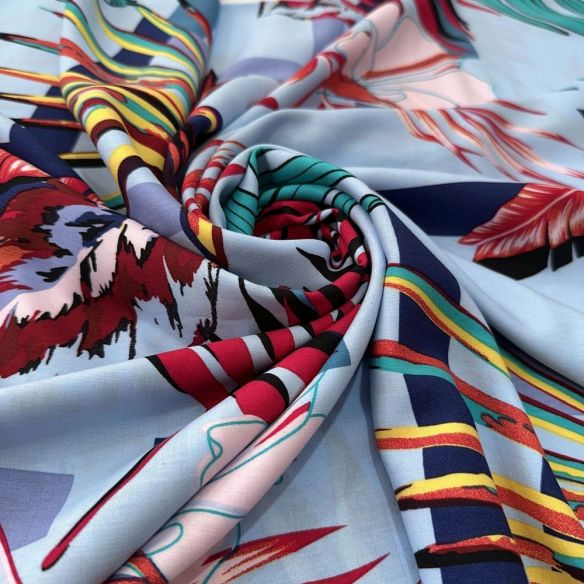 Tecido Viscose Estampada Folhagens Colorido Fundo Azul Claro • Luema