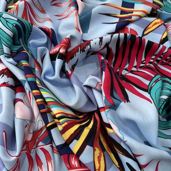 Tecido Viscose Estampada Folhagens Colorido Fundo Azul Claro • Luema